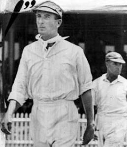 Man in a cricket uniform walking